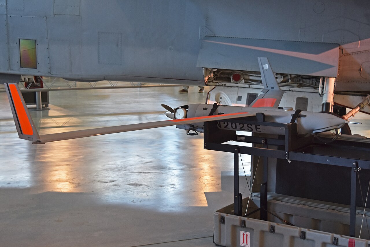 Insitu ScanEagle X200 registration N202SE on a display stand in a museum hangar.